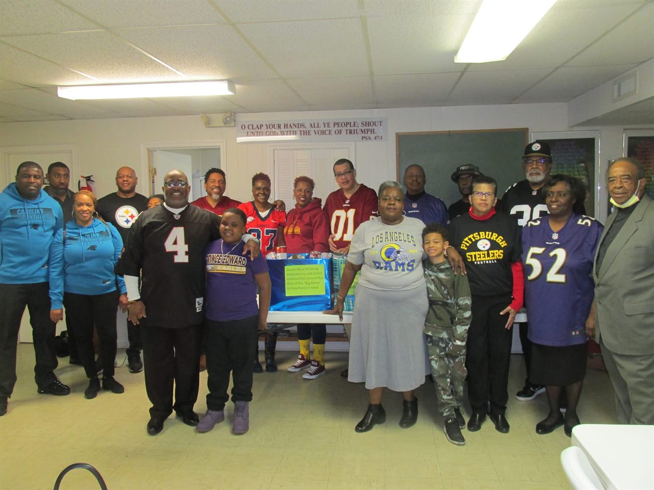 Triumph Baptist Church members in football jerseys at the Souper Bowl of Caring food drive